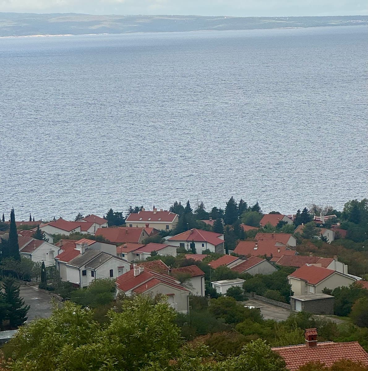 Coastal village with red-roofed houses overlooking the sea